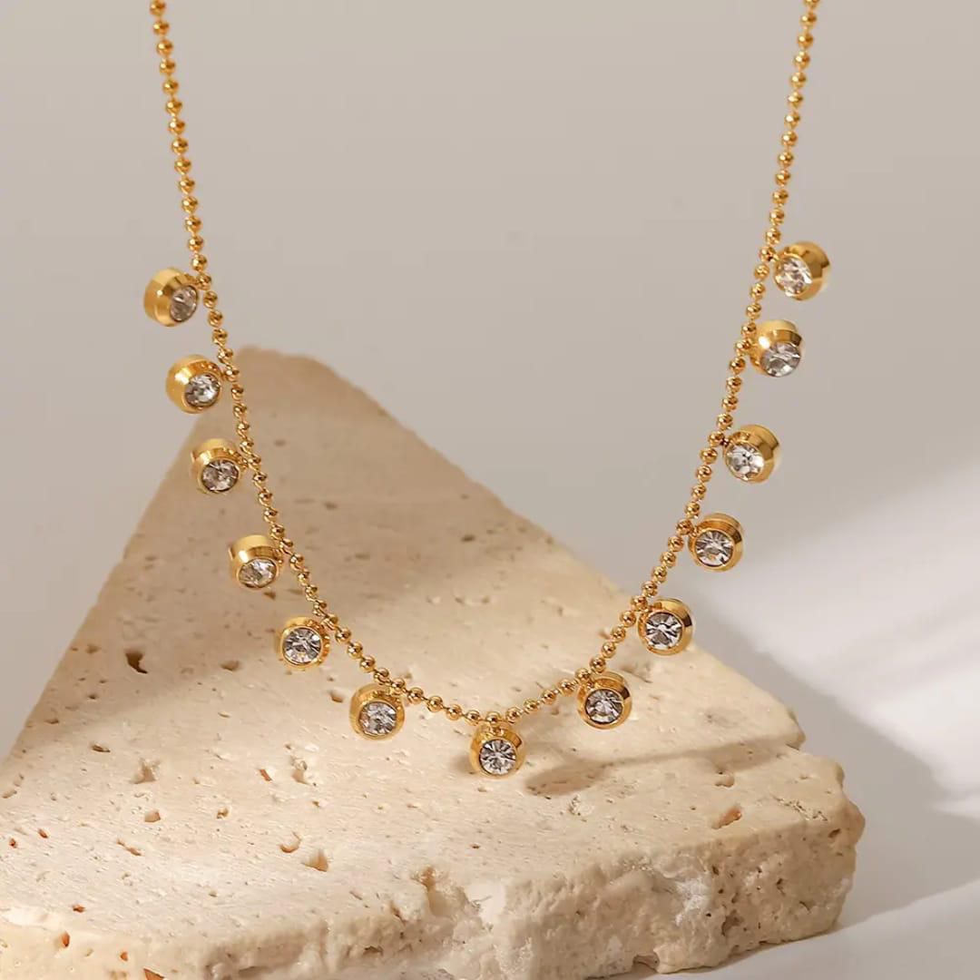 Gold necklace with small diamonds on a stone surface Goldess Jewelley 18k pure gold plated necklace trending