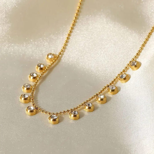 Gold necklace with small round pendants on a light background Goldess Jewelley 18k pure gold plated necklace trending