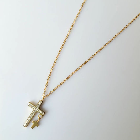 Gold necklace with a cross pendant on a light gray background Goldess jewelley necklace 18k pure gold plating