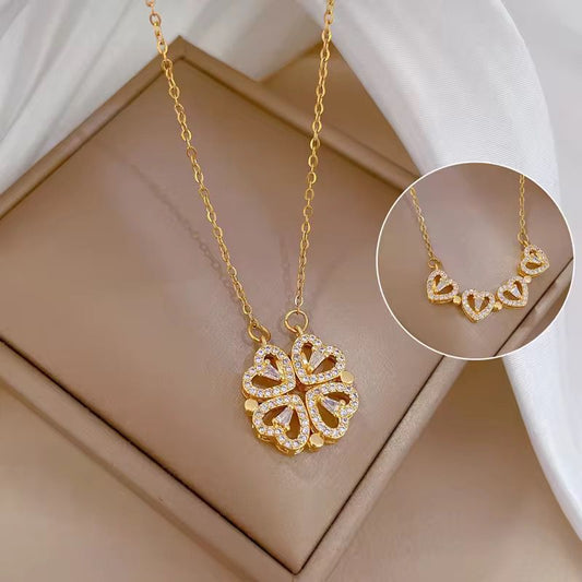 Gold necklace with a detailed pendant on a beige surface The everyday grace necklace 18k pure gold plated